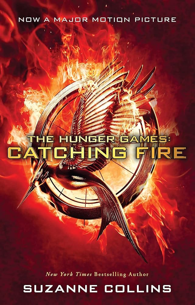 Catching Fire Movie-Tie-in-Edition [Paperback] [Nov 10, 2014] SUZANNE COLLINS cover image